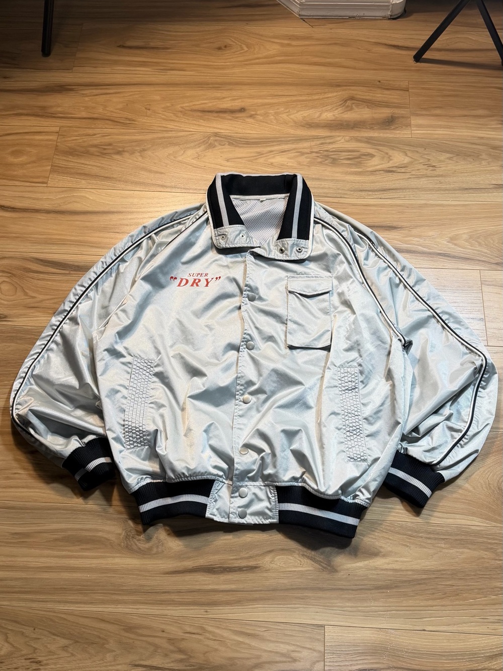 Superdry Silver Bomber Jacket with Black Trim and Red Logo